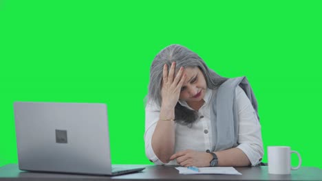 Tensed-Indian-senior-businesswoman-thinking-something-Green-screen