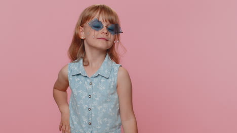 Child-girl-kid-wearing-pink-sunglasses,-charming-smile,-showing-thumbs-up-like,-positive-feedback