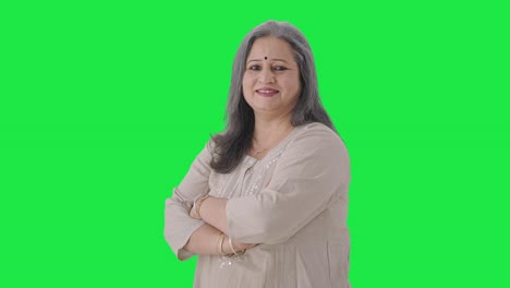 Portrait-of-Happy-Indian-old-woman-standing-crossed-hands-Green-screen