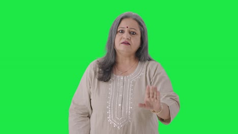 Stressed-Indian-old-woman-shouting-at-someone-Green-screen