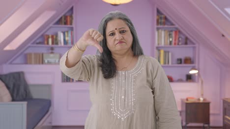 Disappointed-Indian-old-woman-showing-thumbs-down