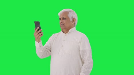 Indian-old-man-talking-on-video-call-Green-screen