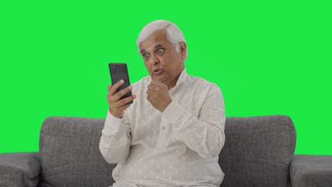 Angry-Indian-old-man-shouting-on-video-call-Green-screen