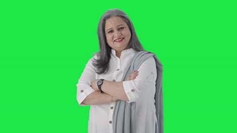 Portrait-of-Happy-Indian-senior-manager-standing-crossed-hands-Green-screen