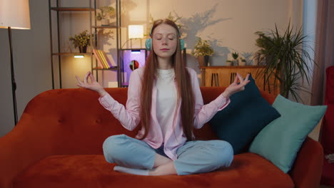 Girl-breathes-deeply-with-mudra-gesture,-eyes-closed,-meditating-with-concentrated-thoughts-peaceful