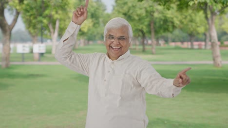 Happy-Indian-old-man-dancing-and-enjoying-in-park