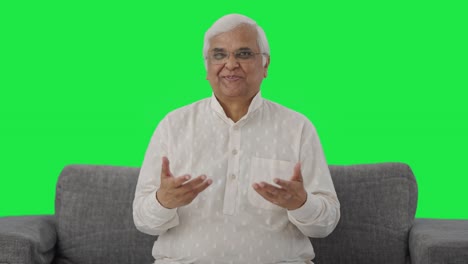 Happy-Indian-old-man-talking-to-the-camera-Green-screen