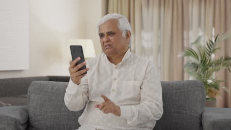 Indian-old-man-talking-on-video-call