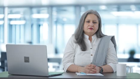 Serious-Indian-senior-businesswoman-staring-at-the-camera