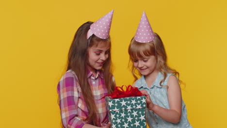 Happy-children-sister-girl-siblings-friends-kids-celebrating-birthday-party-opening-gift-box-present