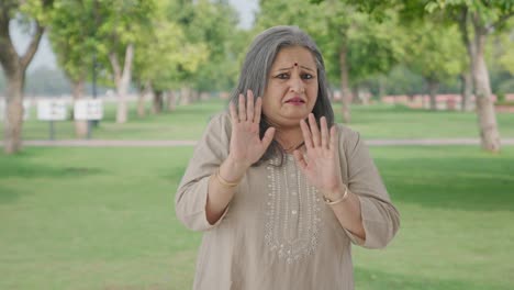 Indian-old-woman-getting-shocked-by-watching-someone-in-park