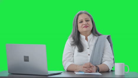 Happy-Indian-senior-businesswoman-smiling-to-the-camera-Green-screen