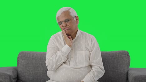 Sick-Indian-old-man-suffering-from-tooth-pain-Green-screen