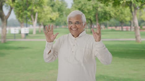 Happy-Indian-old-man-enjoying-and-dancing-in-park