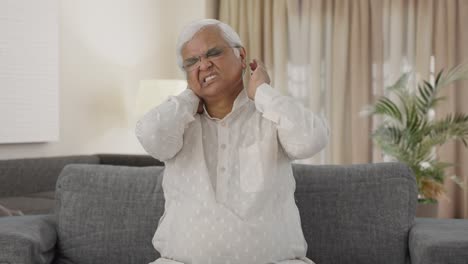 Sick-Indian-old-man-suffering-from-neck-pain