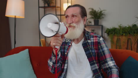 Senior-old-grandfather-man-talking-with-megaphone,-proclaiming-news,-loudly-announcing-advertisement