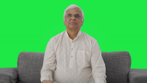 Indian-old-man-watching-TV-Green-screen