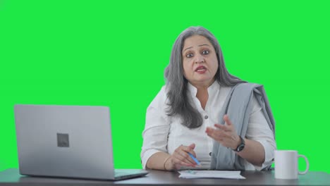 Angry-Indian-senior-businesswoman-shouting-to-someone-Green-screen