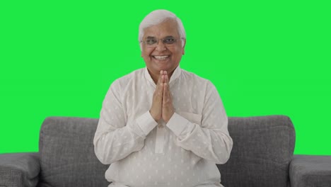 Happy-Indian-old-man-greeting-and-doing-Namaste-Green-screen