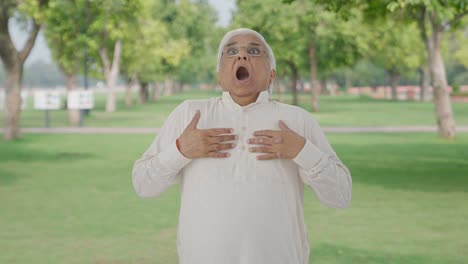 Sick-Indian-old-man-having-an-Asthma-attack-in-park