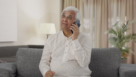 Angry-Indian-old-man-talking-on-phone