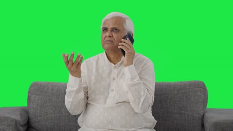 Indian-old-man-talking-on-phone-Green-screen