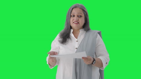 Happy-Indian-senior-female-manager-talking-in-a-meeting-Green-screen