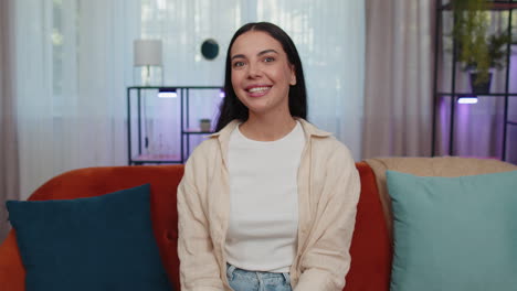 Happy-cheerful-young-woman-looking-approvingly-at-camera-showing-ok-gesture,-positive-like-sign