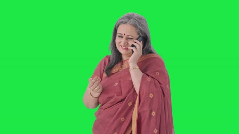 Happy-Indian-old-woman-talking-on-phone-Green-screen