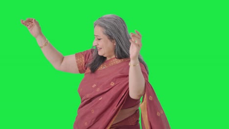 Happy-Indian-old-woman-dancing-and-enjoying-Green-screen