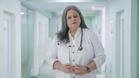 Indian-senior-female-doctor-looking