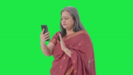 Indian-old-woman-talking-on-video-call-Green-screen