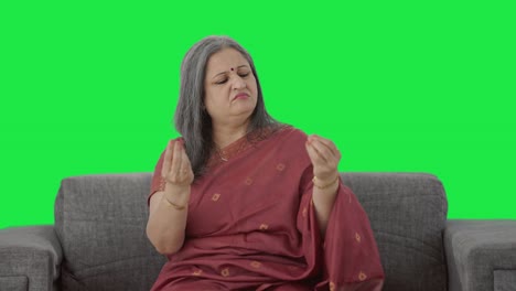 Sick-Indian-old-woman-suffering-from-hairfall-Green-screen