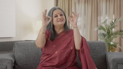 Happy-Indian-old-woman-showing-okay-sign