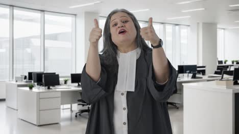 Happy-Indian-senior-female-lawyer-showing-thumbs-up