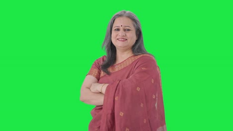 Portrait-of-Happy-Indian-old-woman-standing-crossed-hands-Green-screen