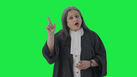 Indian-senior-female-lawyer-fighting-the-case-in-court-Green-screen