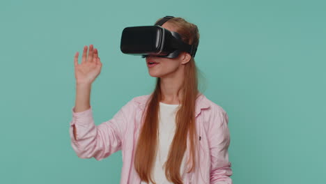 Excited-girl-using-headset-helmet-app-to-play-simulation-game,-watching-virtual-reality-3D-360-video