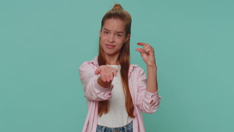 Girl-kid-showing-a-little-bit-gesture-with-sceptic-smile,-showing-minimum-sign,-measuring-small-size