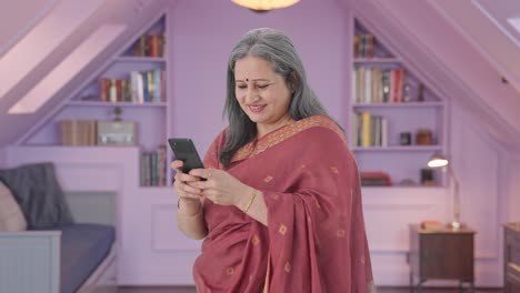 Happy-Indian-old-woman-chatting-on-phone