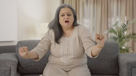 Tired-and-sleepy-Indian-old-woman-yawning