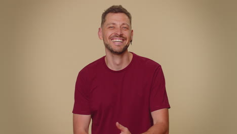 Portrait-of-happy-bearded-handsome-young-man-looking-at-camera,-smiling,-adult-stylish-male-guy