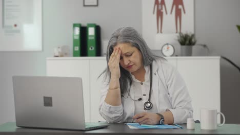 Tensed-and-stressed-Indian-senior-female-doctor