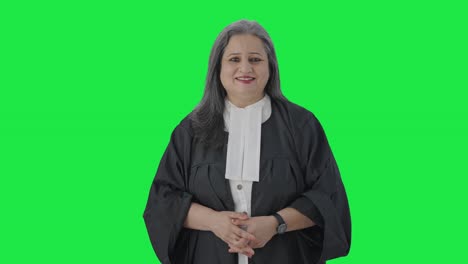 Happy-Indian-senior-female-lawyer-smiling-to-the-camera-Green-screen