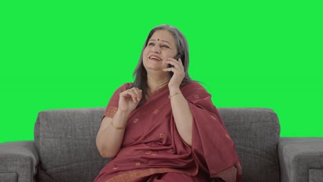 Happy-Indian-old-woman-talking-on-call-Green-screen