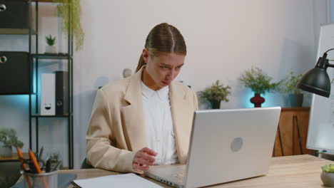 Happy-business-woman-looking-approvingly-at-camera-showing-thumbs-up,-like-positive-sign,-good-news