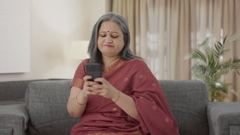 Angry-Indian-old-woman-chatting-on-phone