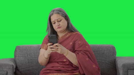 Indian-old-woman-chatting-on-phone-Green-screen