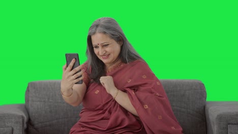 Happy-Indian-old-woman-talking-on-video-call-Green-screen