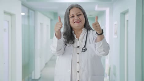 Happy-Indian-senior-female-doctor-showing-thumbs-up